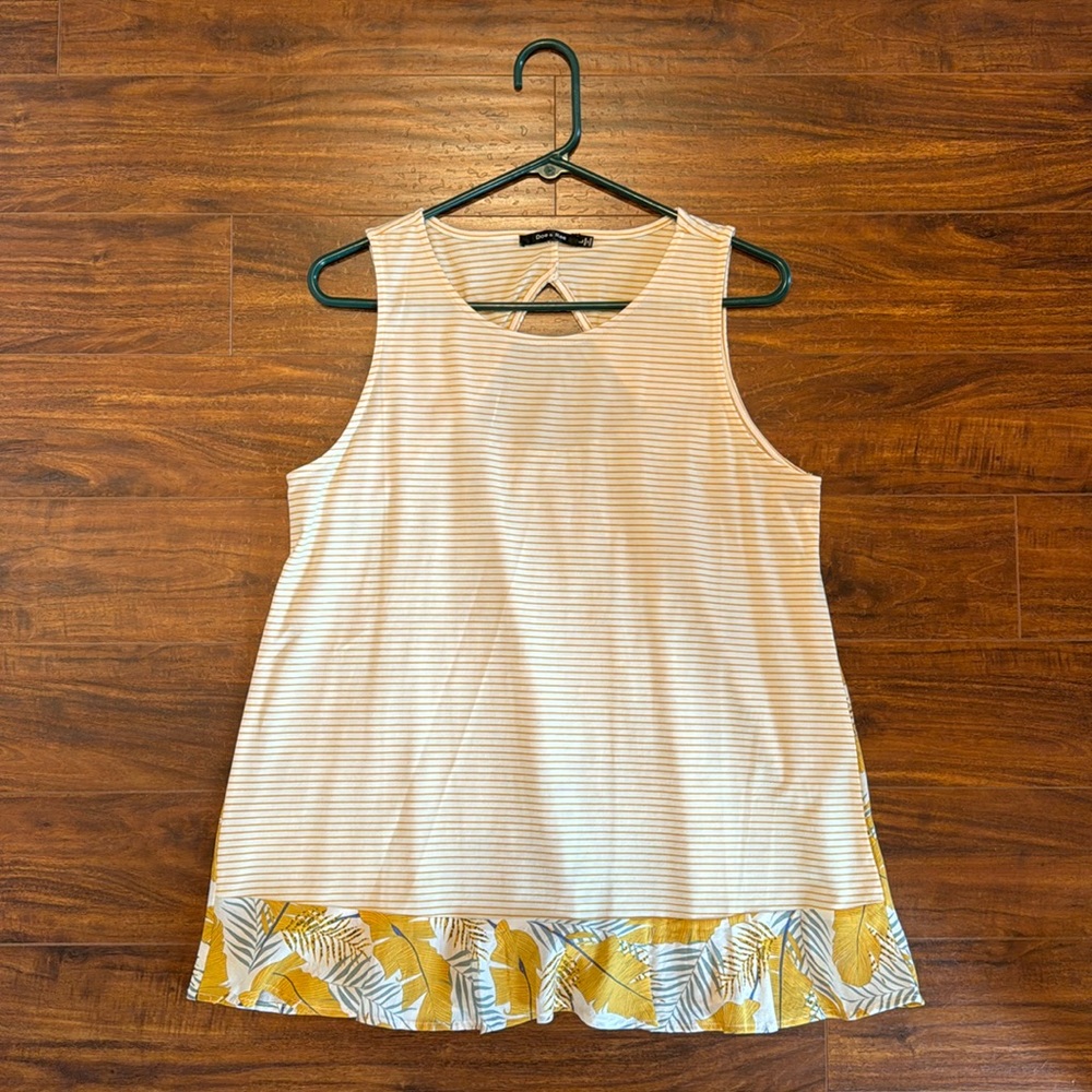 Flared, sleeveless, tunic style top